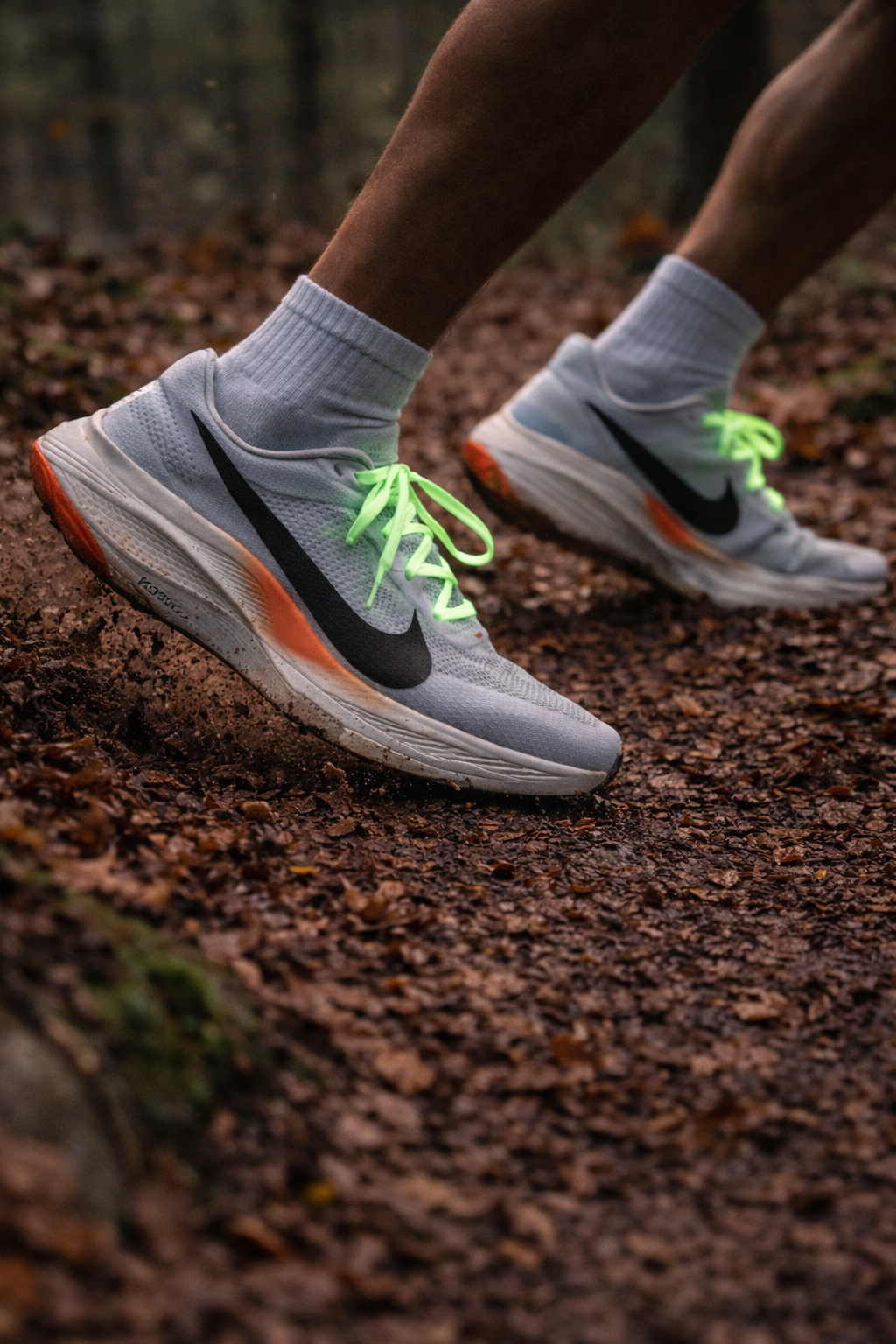 GlowLaces on shoes running through a darker trail